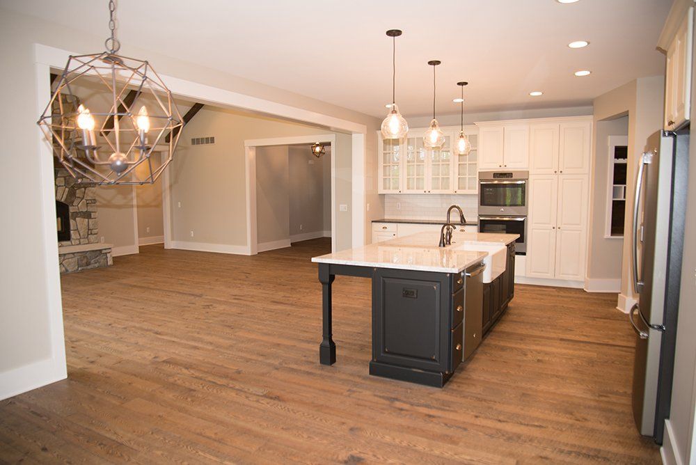There is a large island in the middle of the kitchen.
