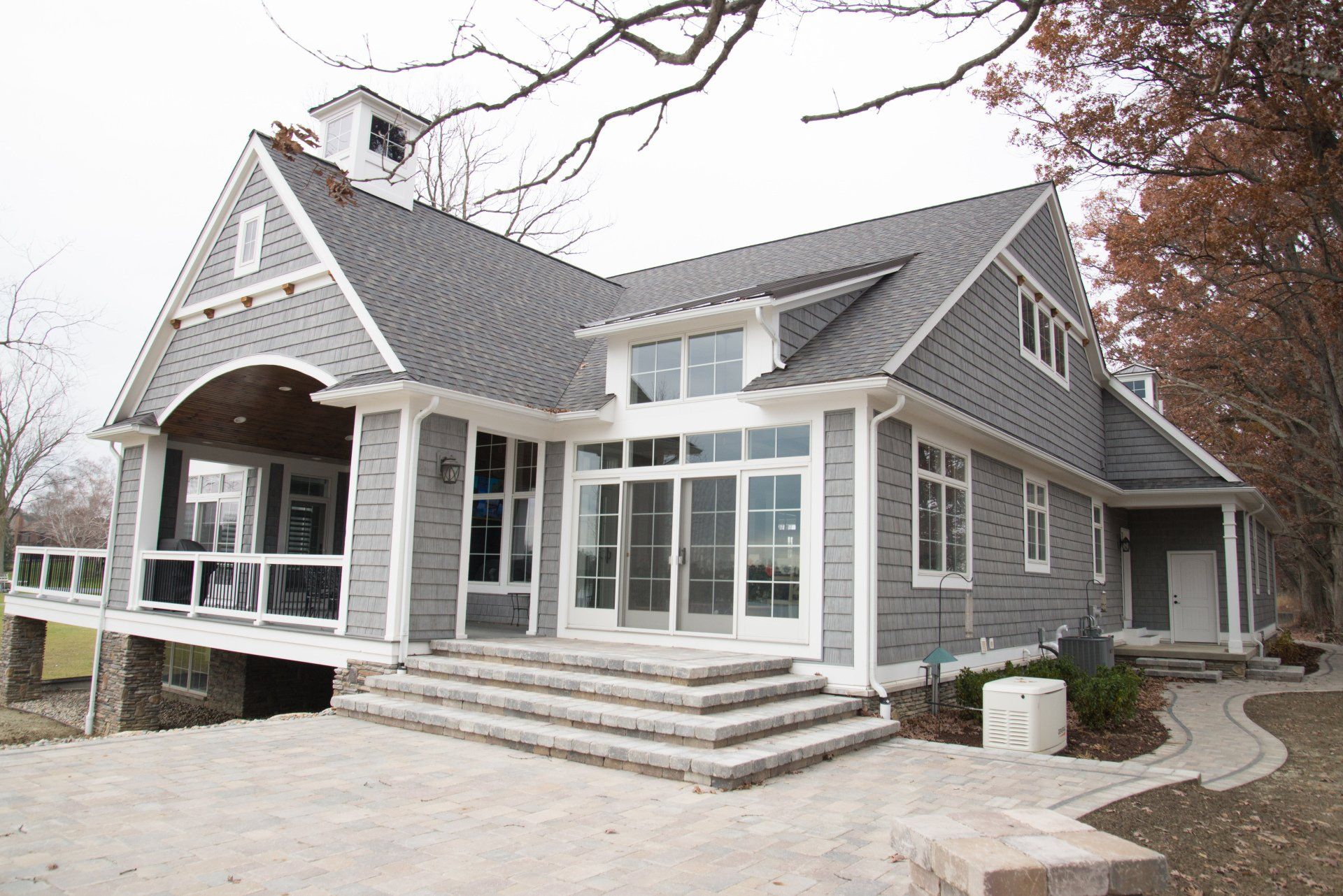 A large house with a lot of windows and stairs