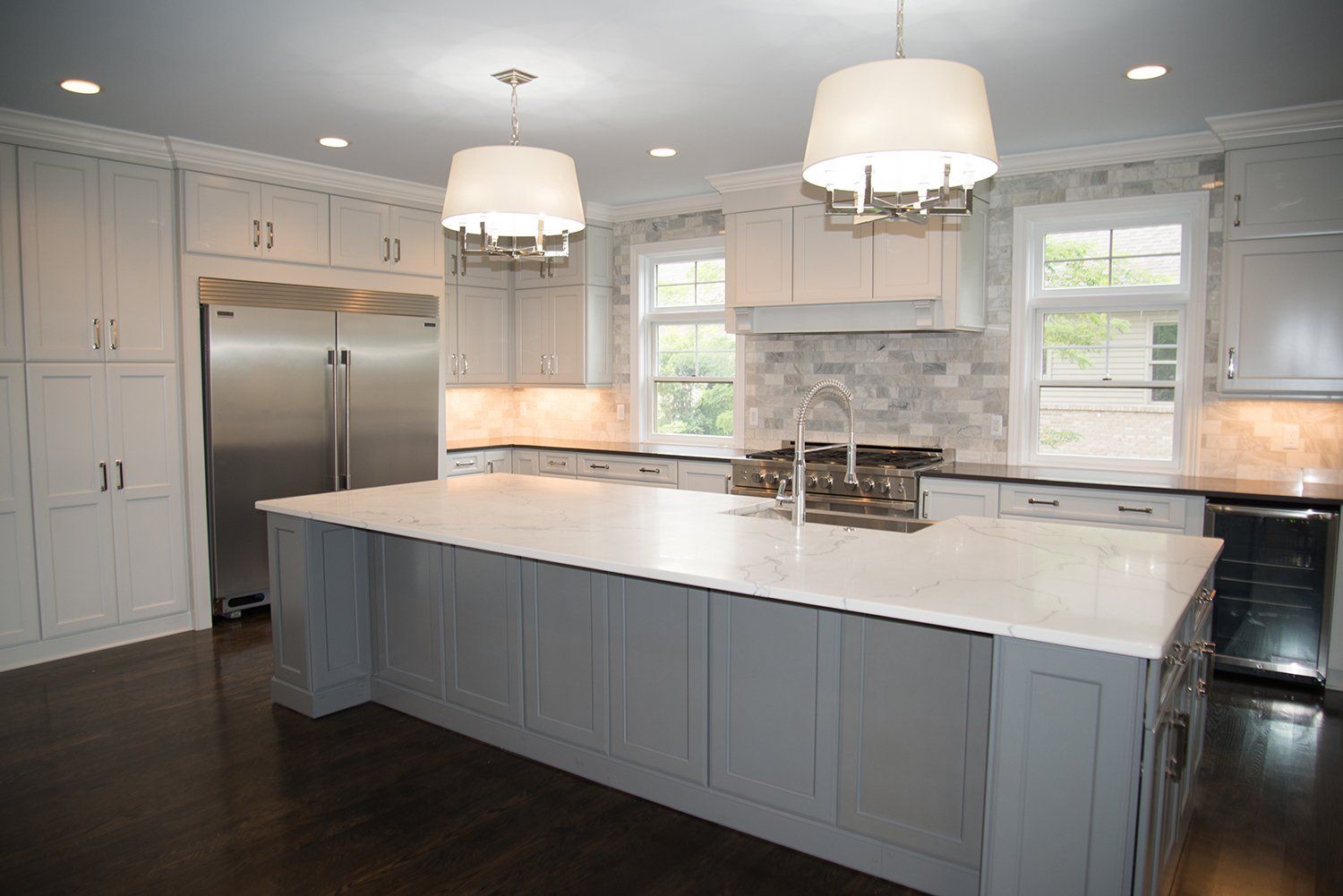 There is a large island in the middle of the kitchen.