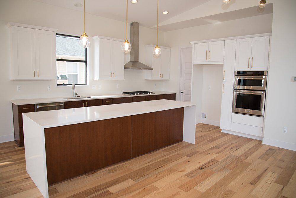 There is a large island in the middle of the kitchen.