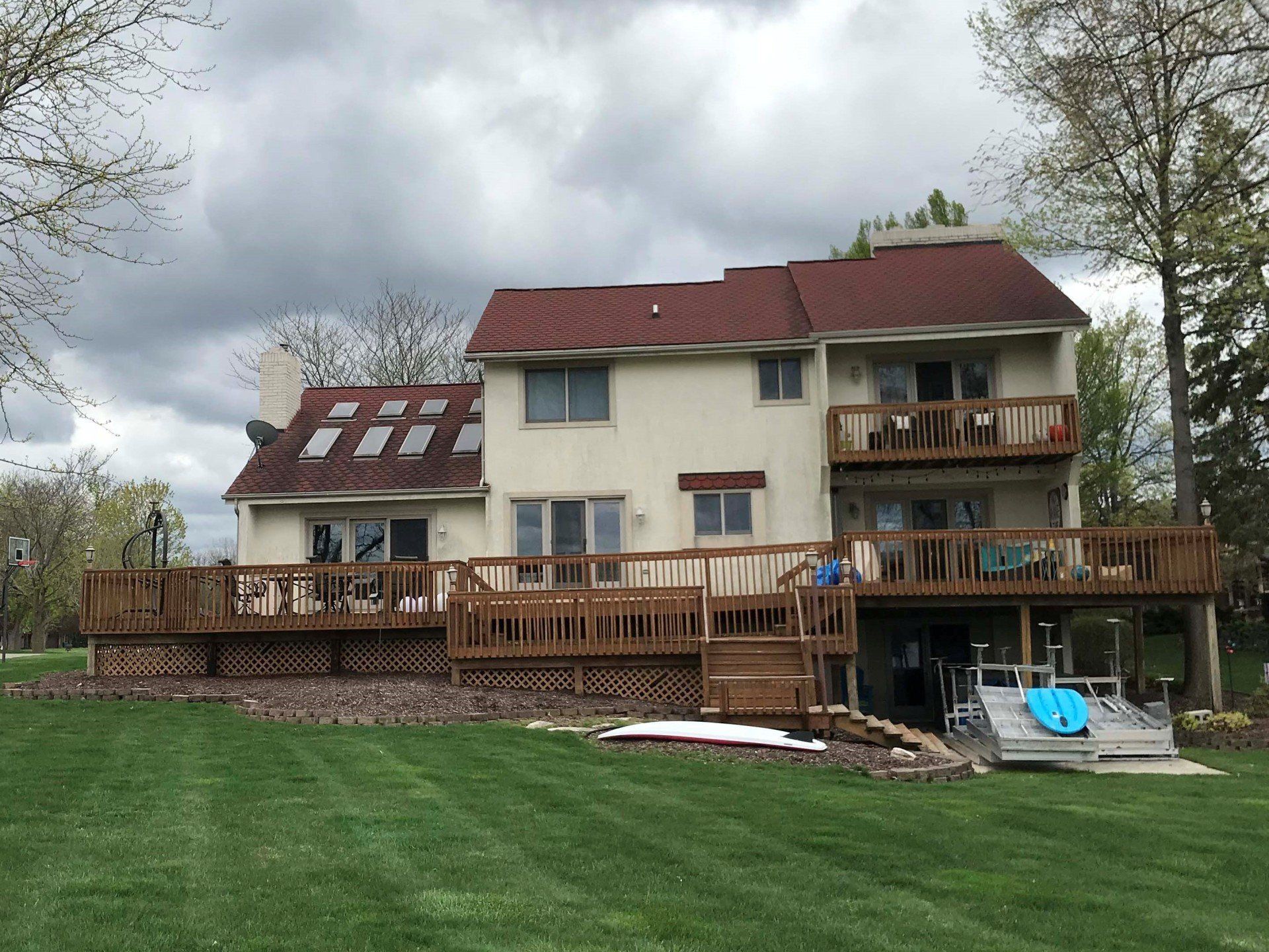 A large house with a large deck in front of it