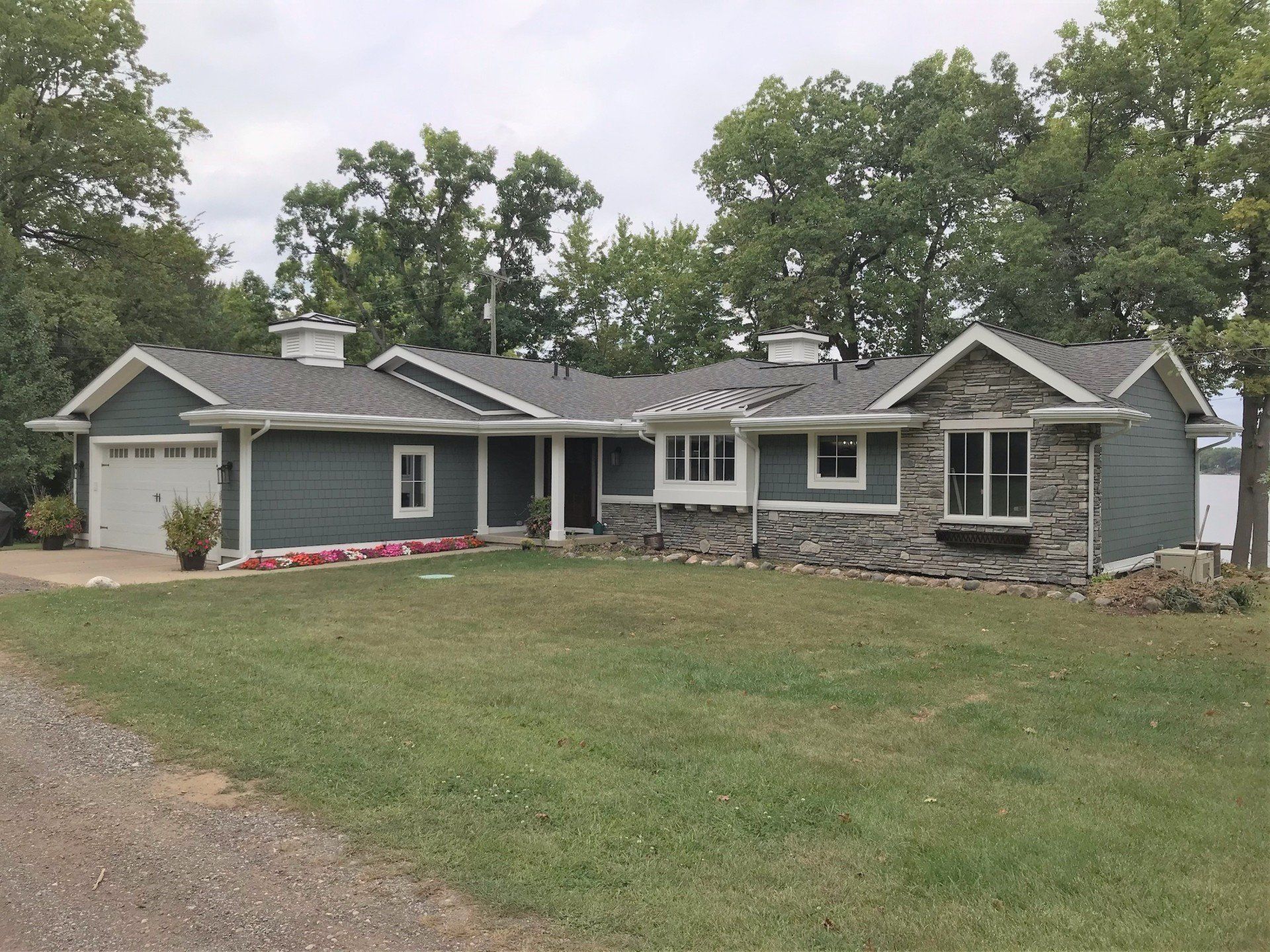A large house with a large lawn in front of it