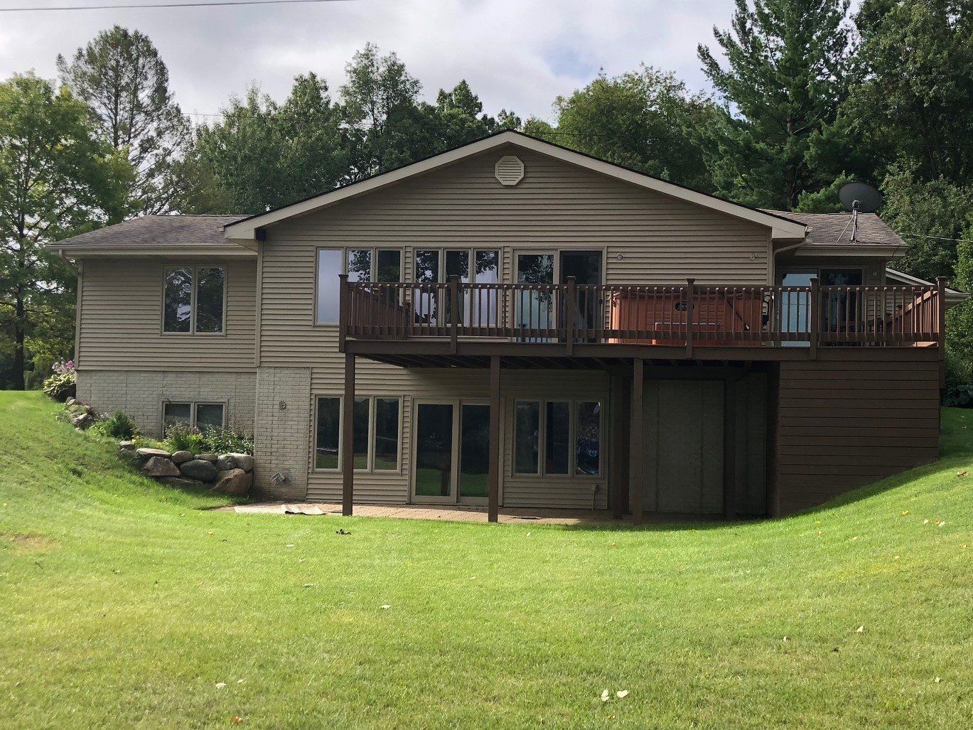A large house with a large lawn in front of it