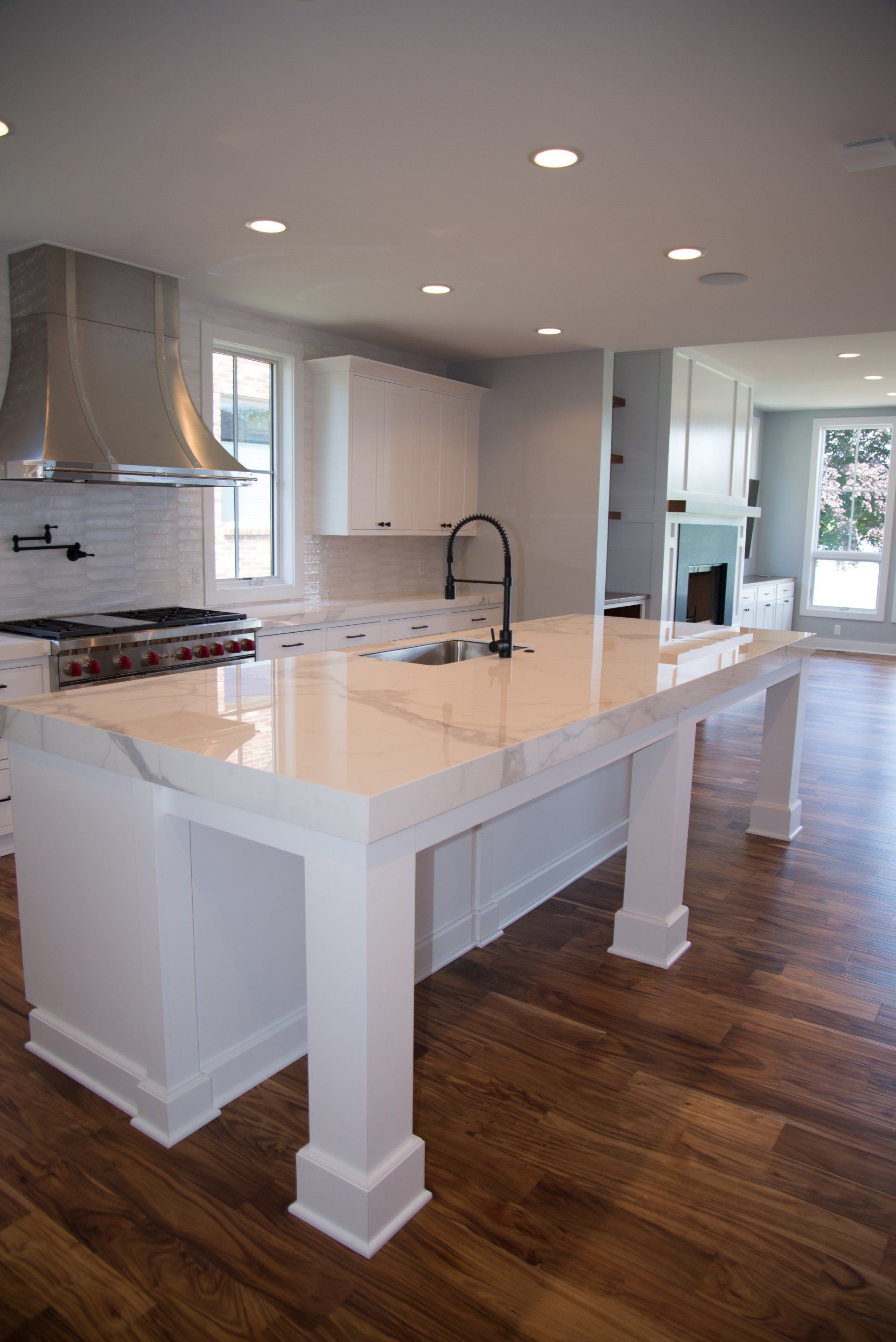 There is a large island in the middle of the kitchen.