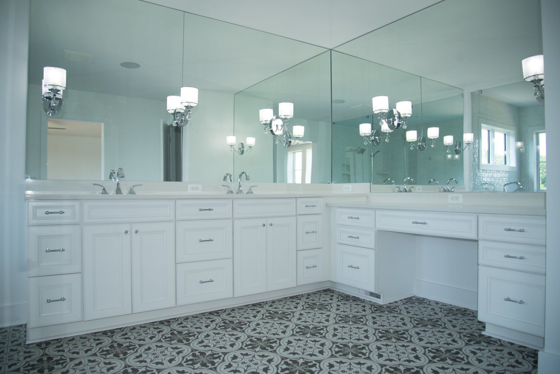 A bathroom with two sinks and a large mirror.