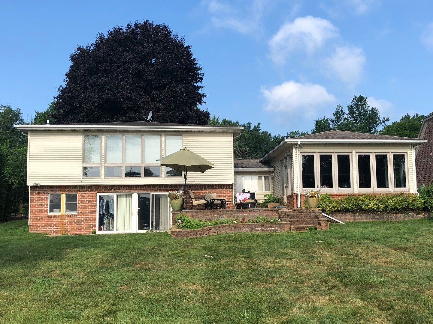 A large house with a large lawn in front of it
