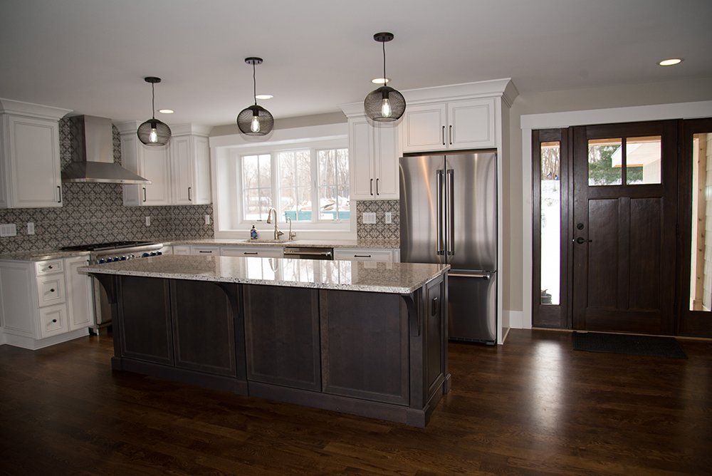 There is a large island in the middle of the kitchen.