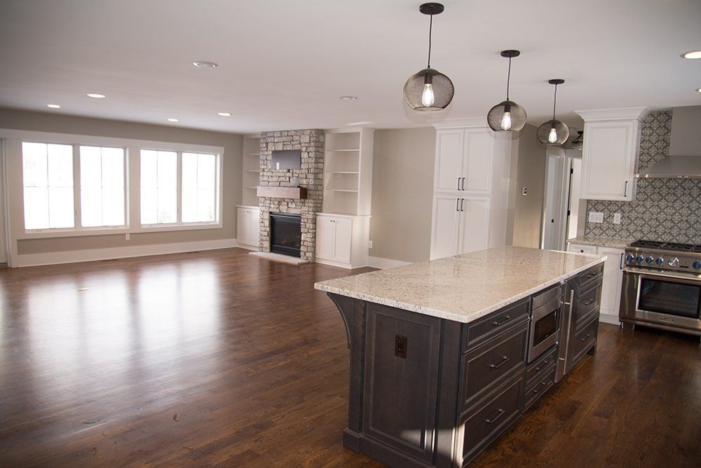 There is a large island in the middle of the kitchen.
