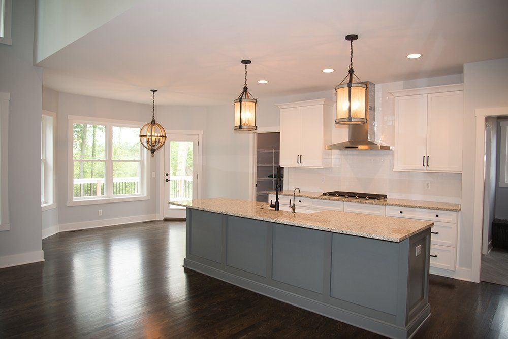There is a large island in the middle of the kitchen.