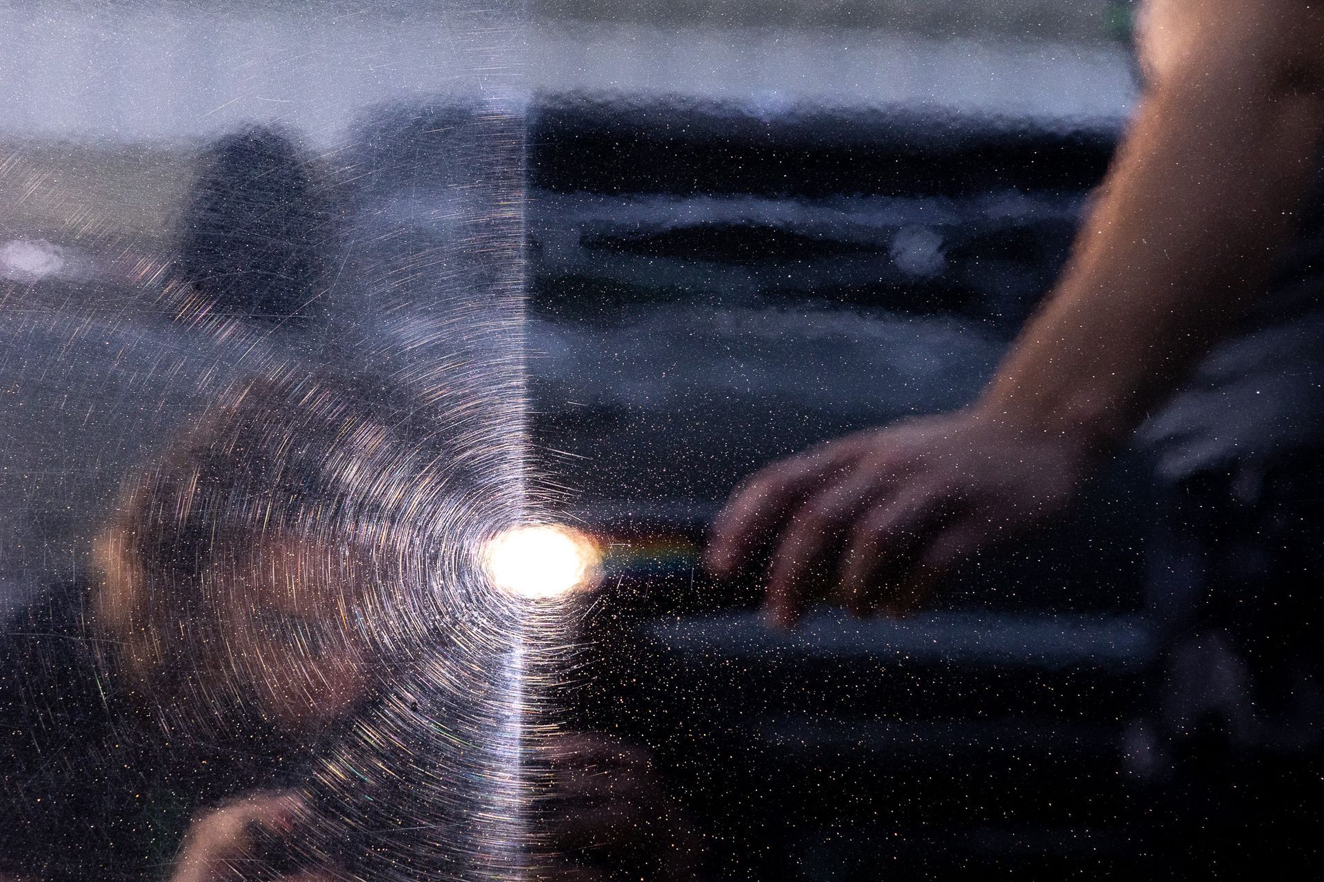 Before and After polishing out car wash swirls to reveal a high gloss finish. Lit by a detail work light.