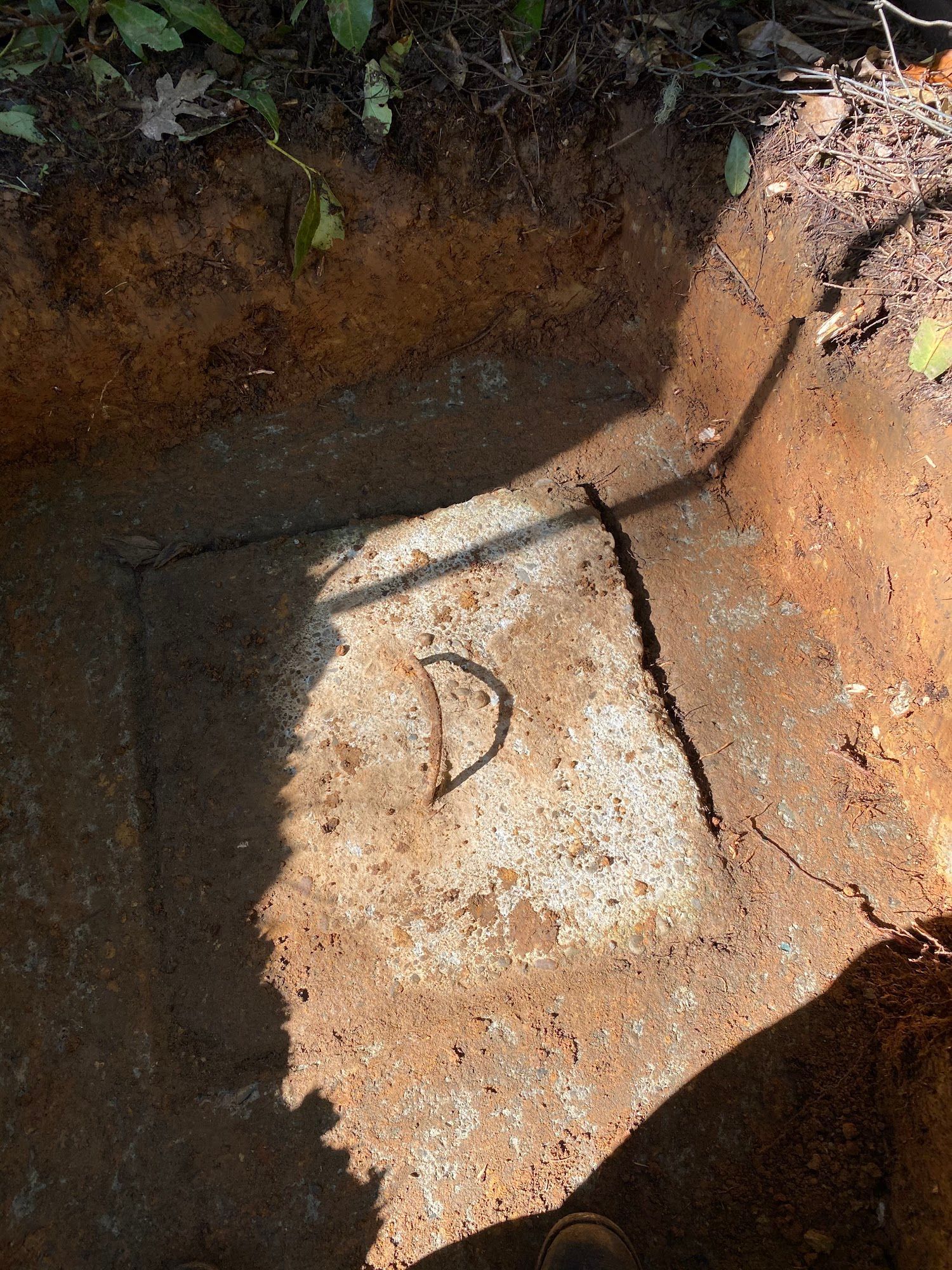 Gray and maroon Dodge Charger on tiled floor, low rider with red accents, under hexagon lights.