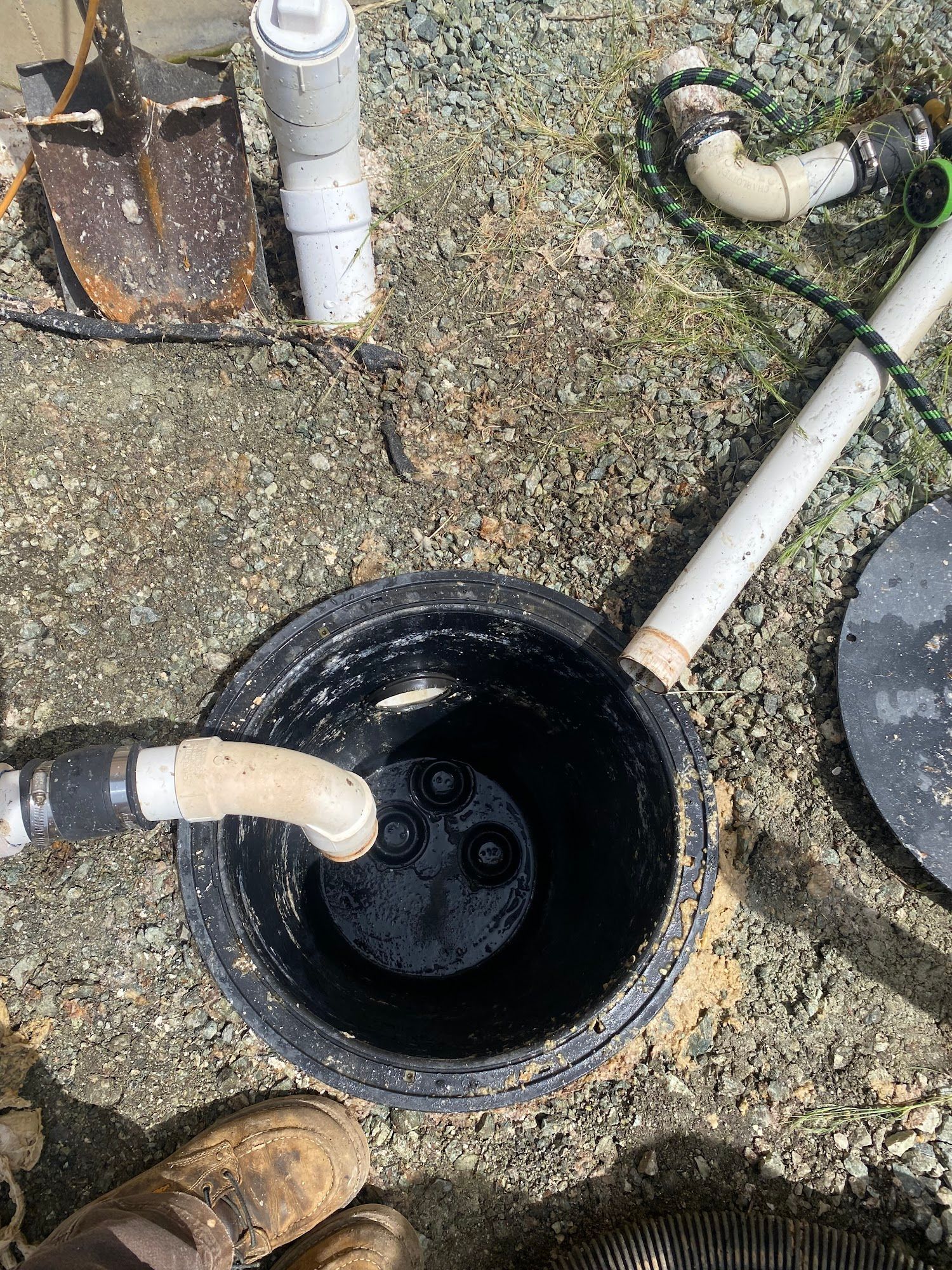 Tesla with a purple and blue iridescent wrap parked in a garage with hexagon lights and a checkered floor.