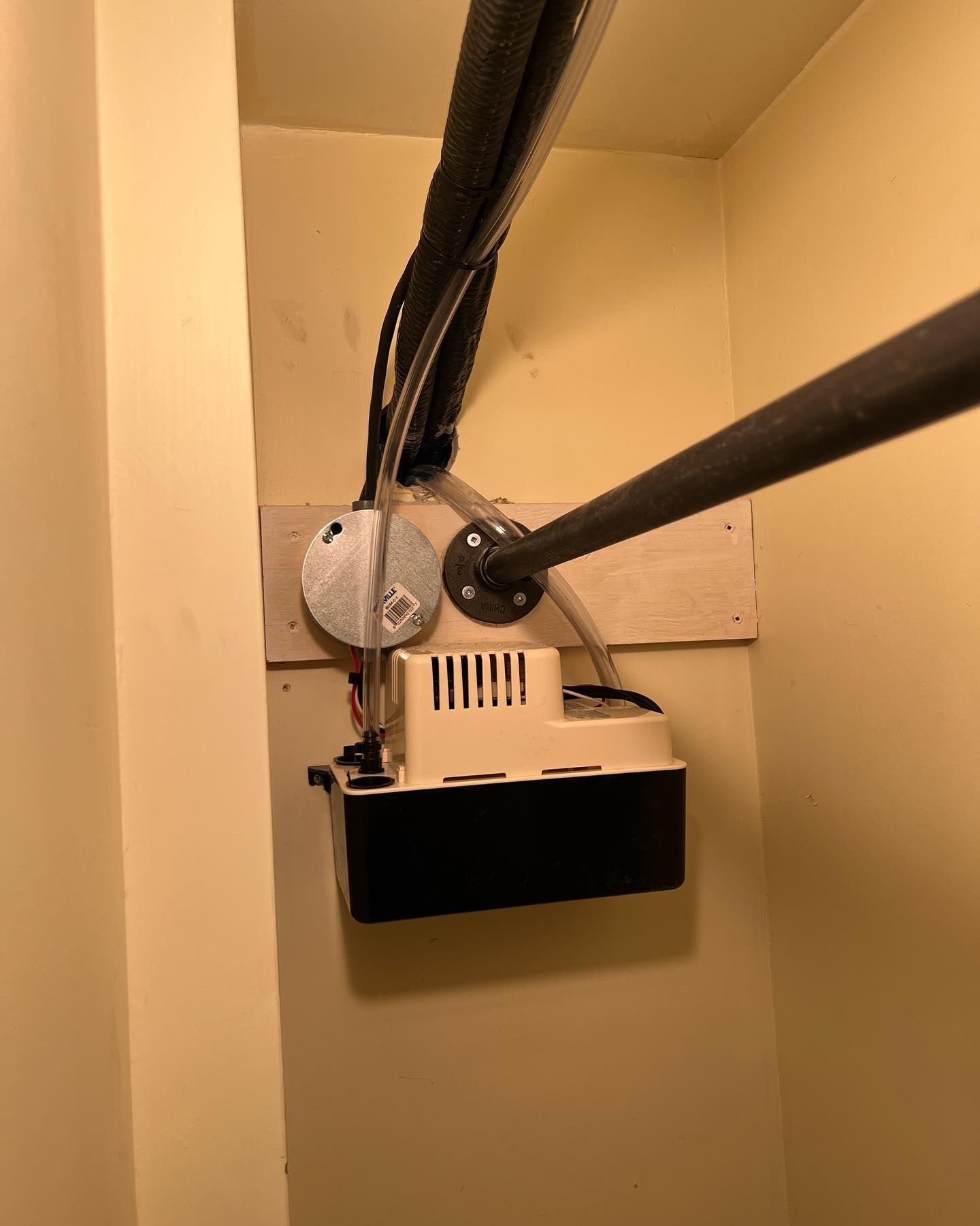 A machine is hanging from the ceiling of a room.