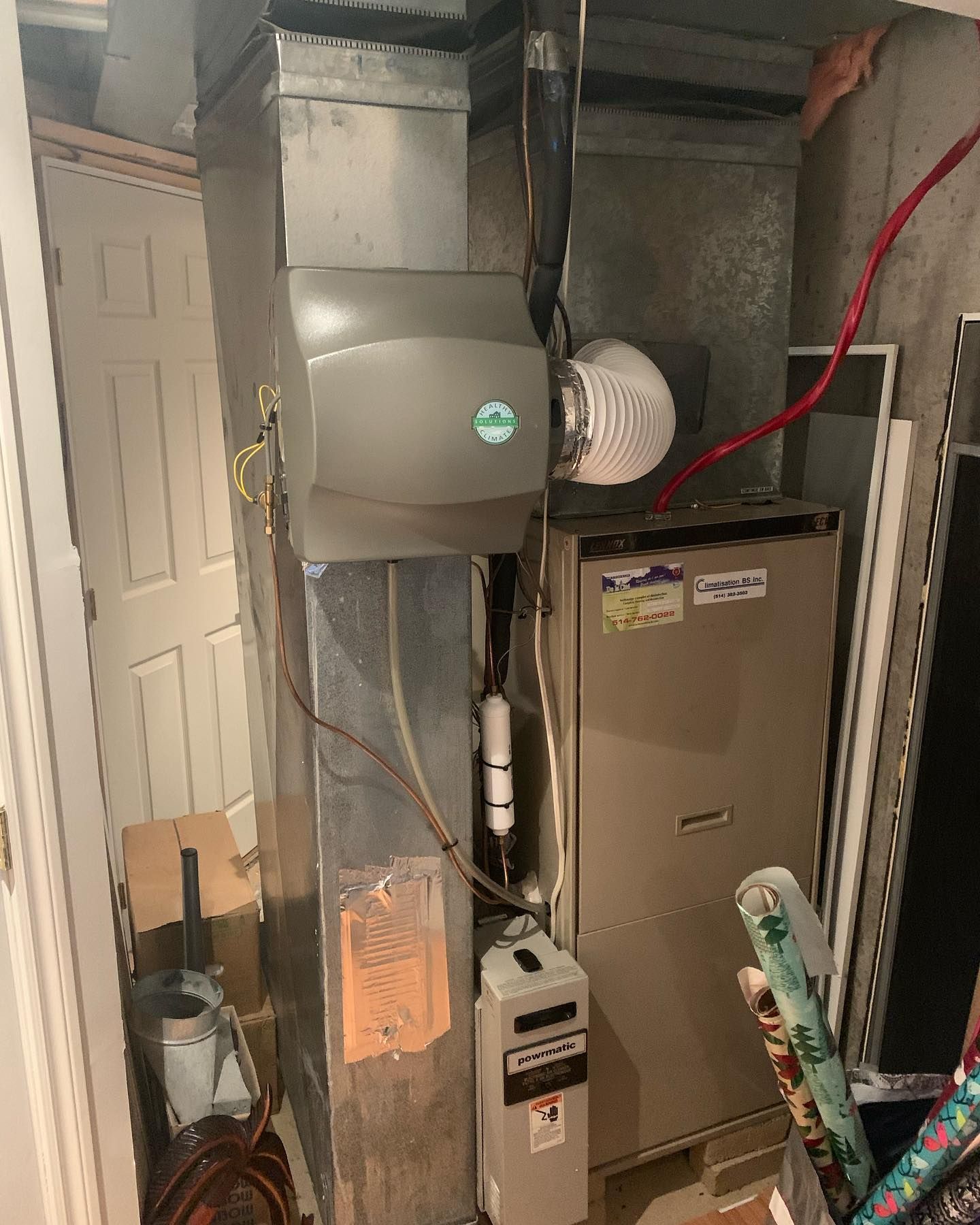 A room with a heater and a furnace in it.