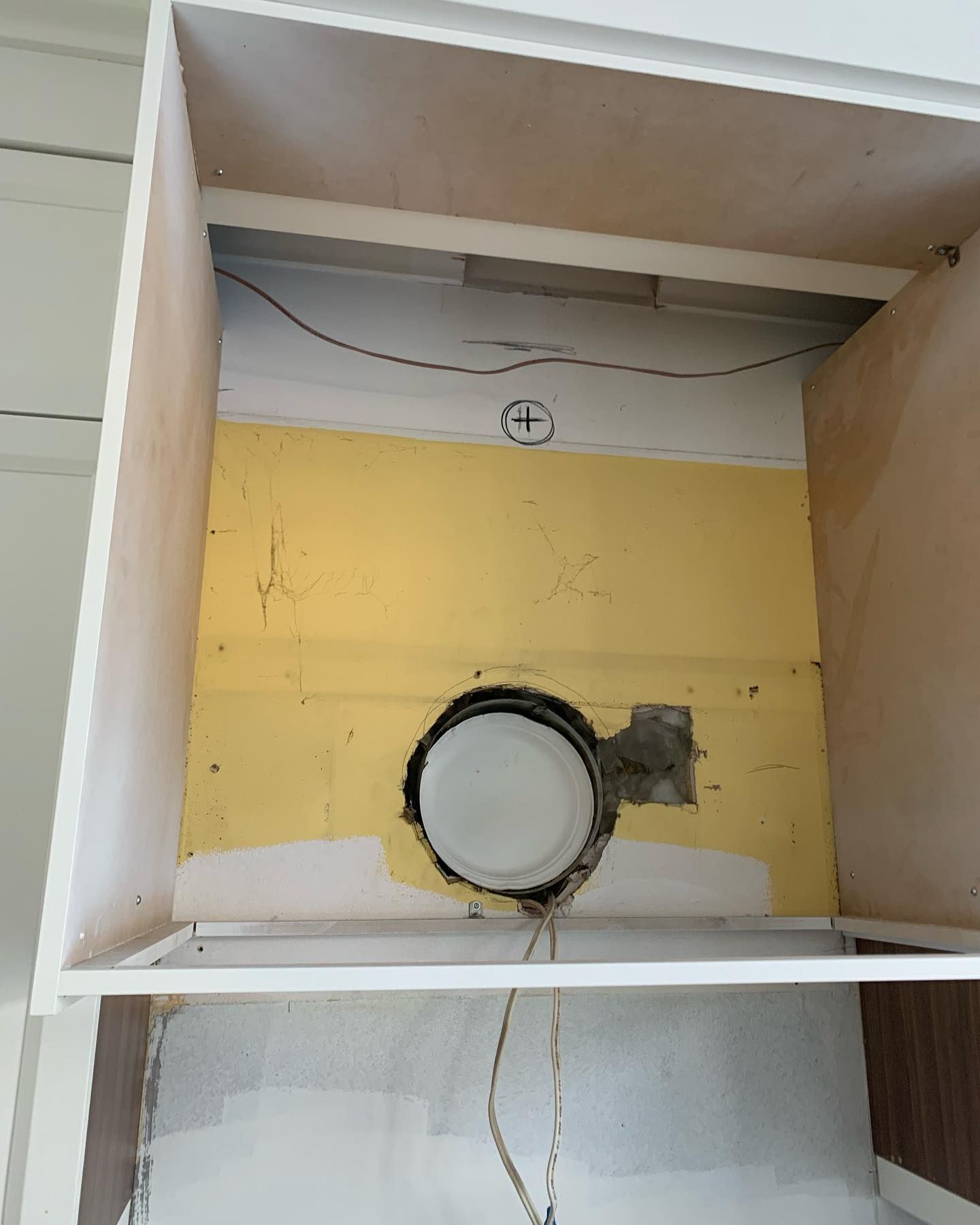 The inside of a cabinet with a light inside of it