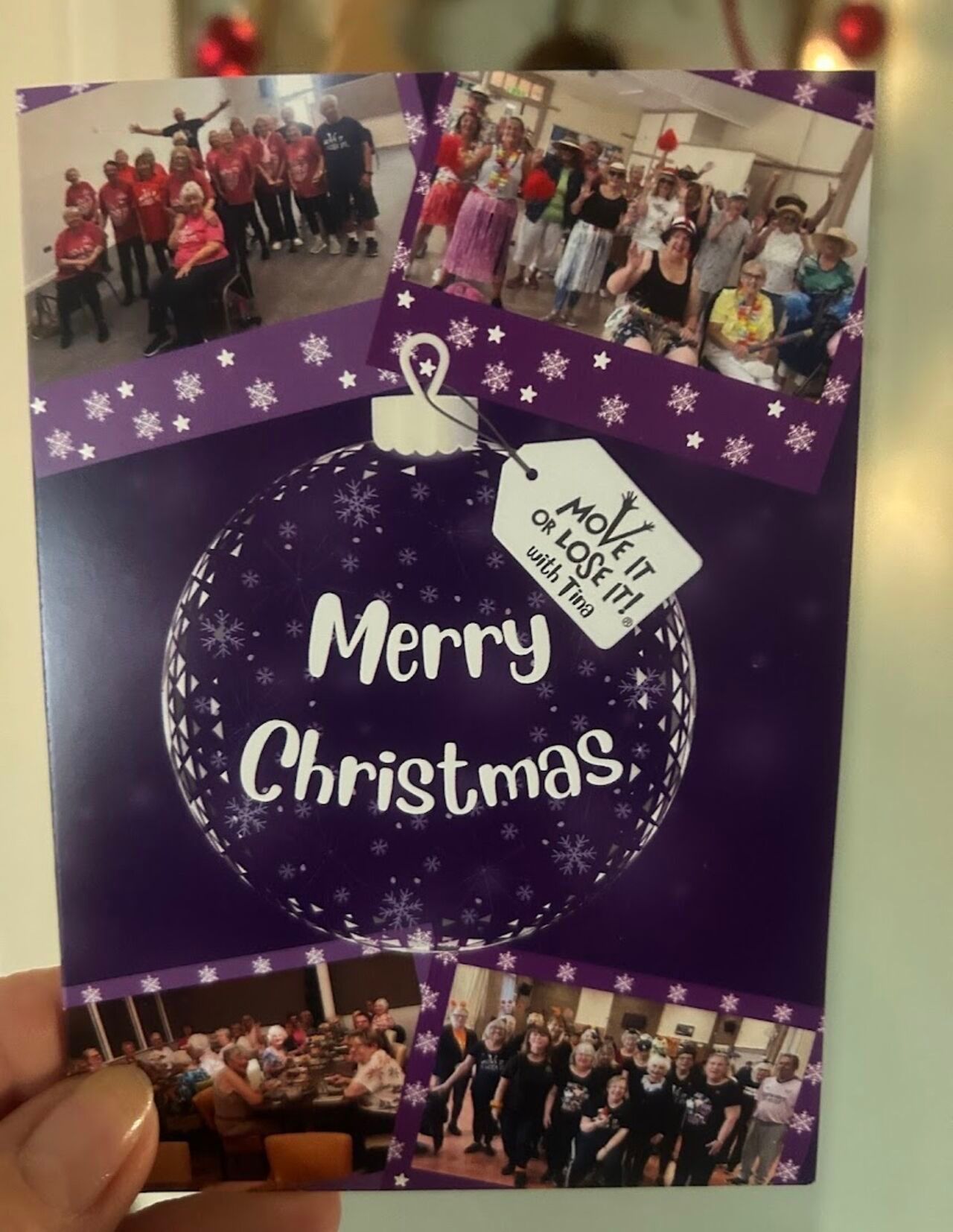Christmas card with purple ornament, photos of a group, and the phrase 