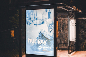 Billboard at bus stop with the word 