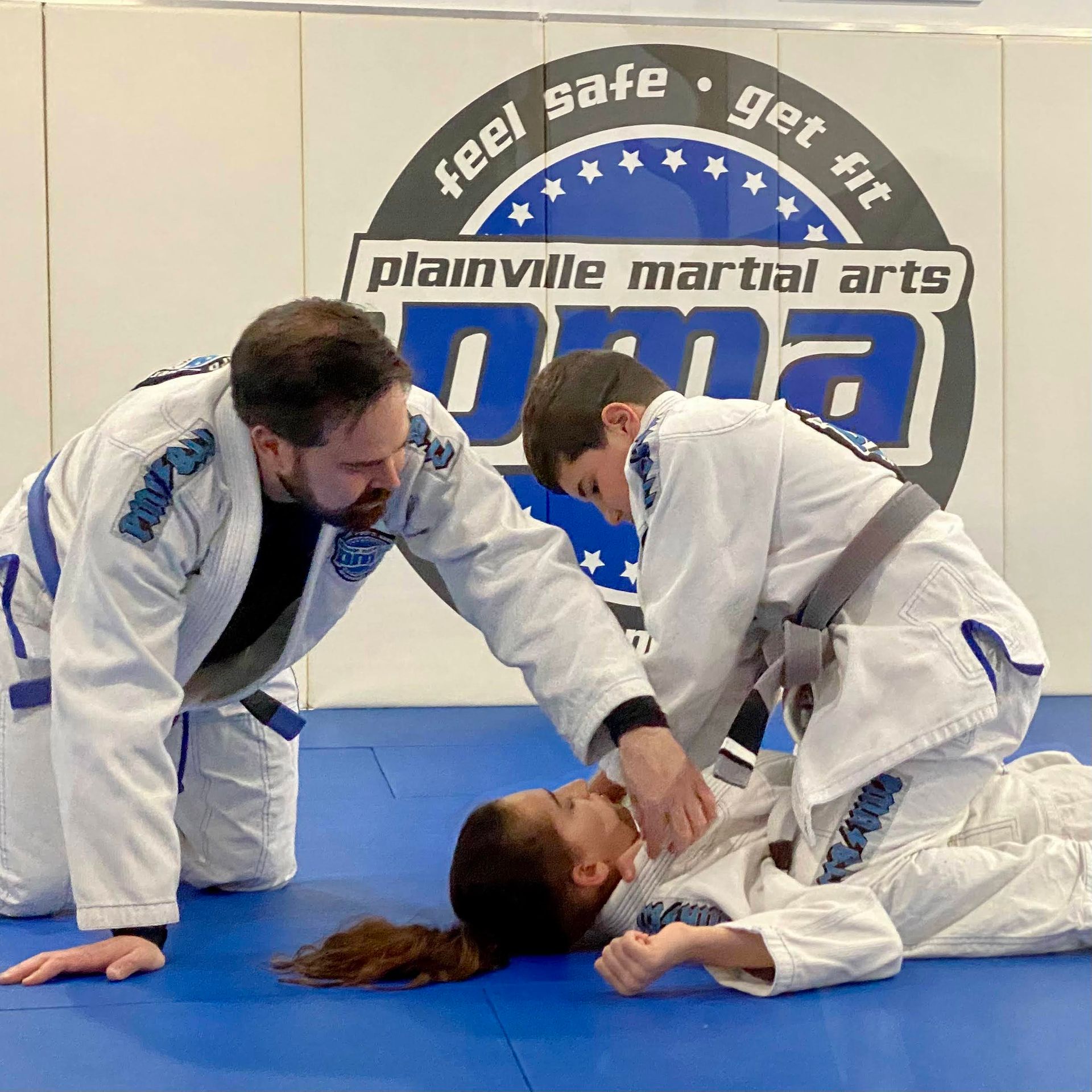 Kids practicing kicks in an after school class at Plainville Martial Arts in Plainville, CT.