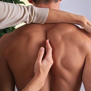 Chiropractic — Man Having Chiropractic Back Adjustment in Redding, CA