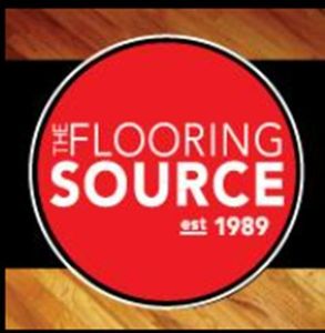 The logo for the flooring source is on a wooden floor