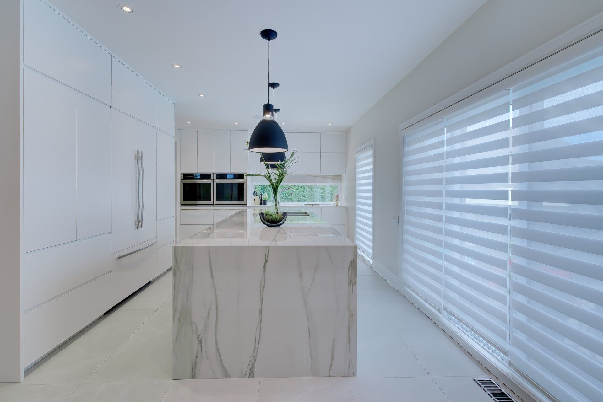 There is a large island in the middle of the kitchen.