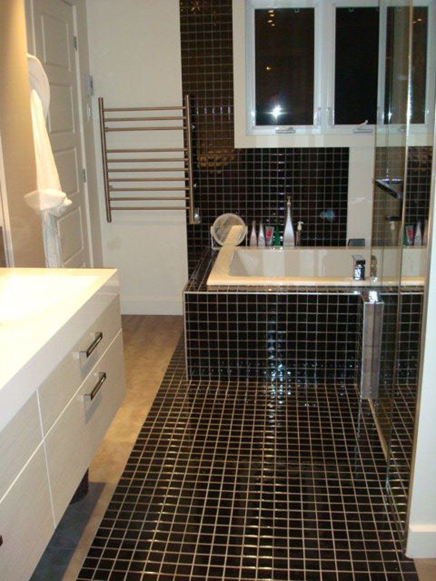 modern bathroom with black tile flooring