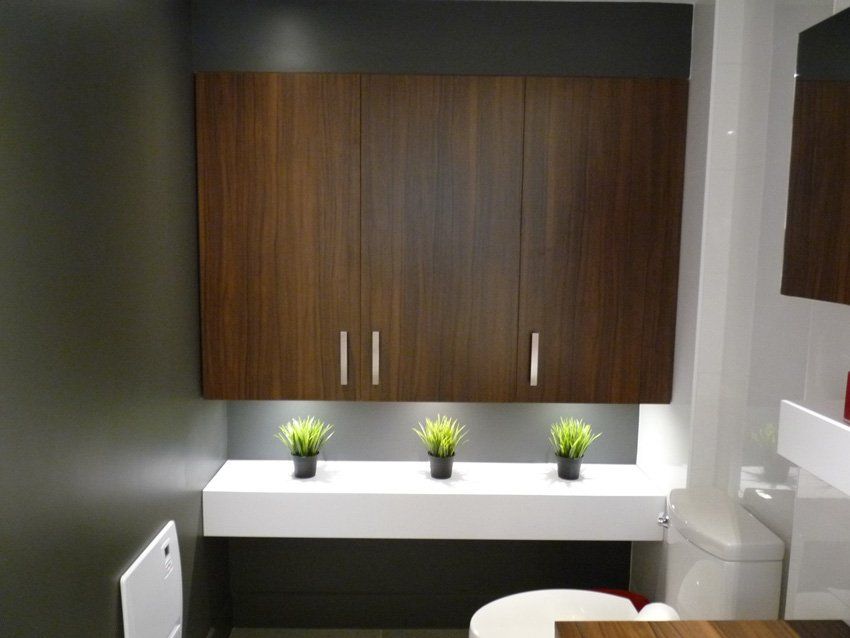 bathroom with large brown storage cabinets