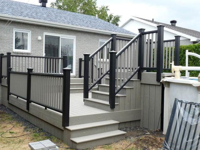 grey composite patio with with black aluminum railing