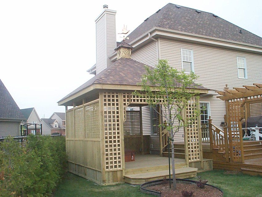 enclosed backyard gazebo made of wood