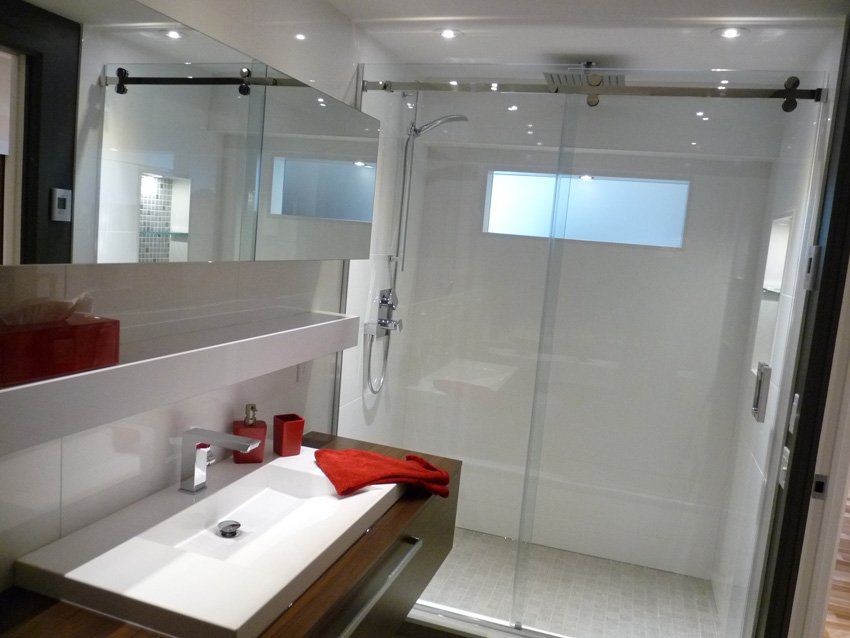 large modern bathroom with glass door shower
