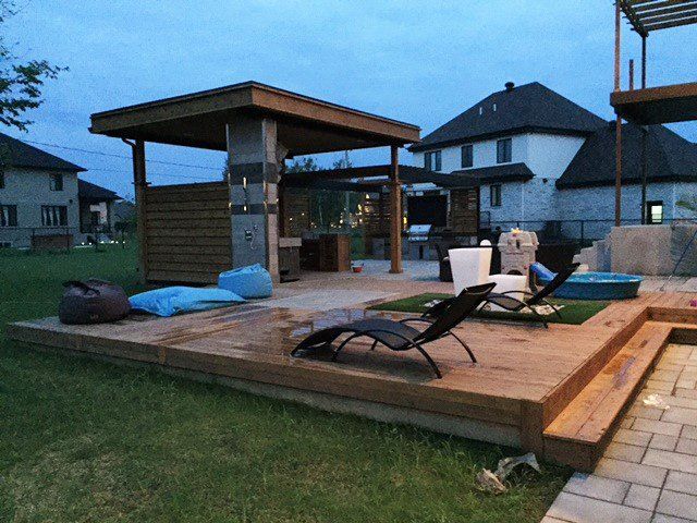 backyard with large modern gazebos and decks