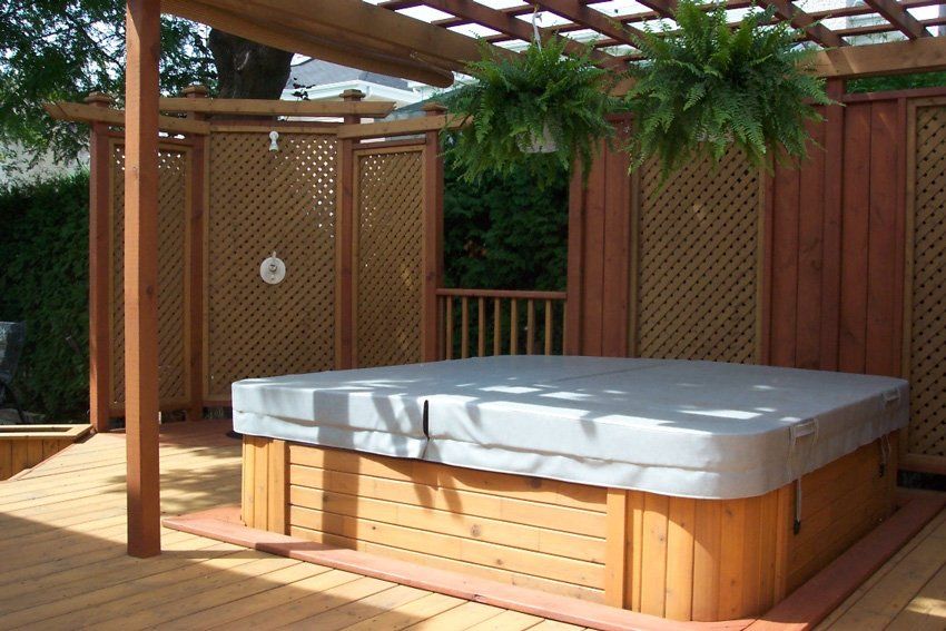 backyard wooden patio gazebo and spa