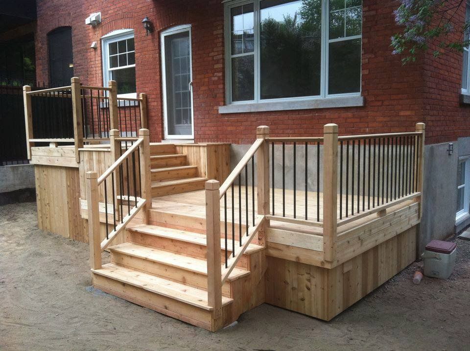 backyard with wood deck and patio