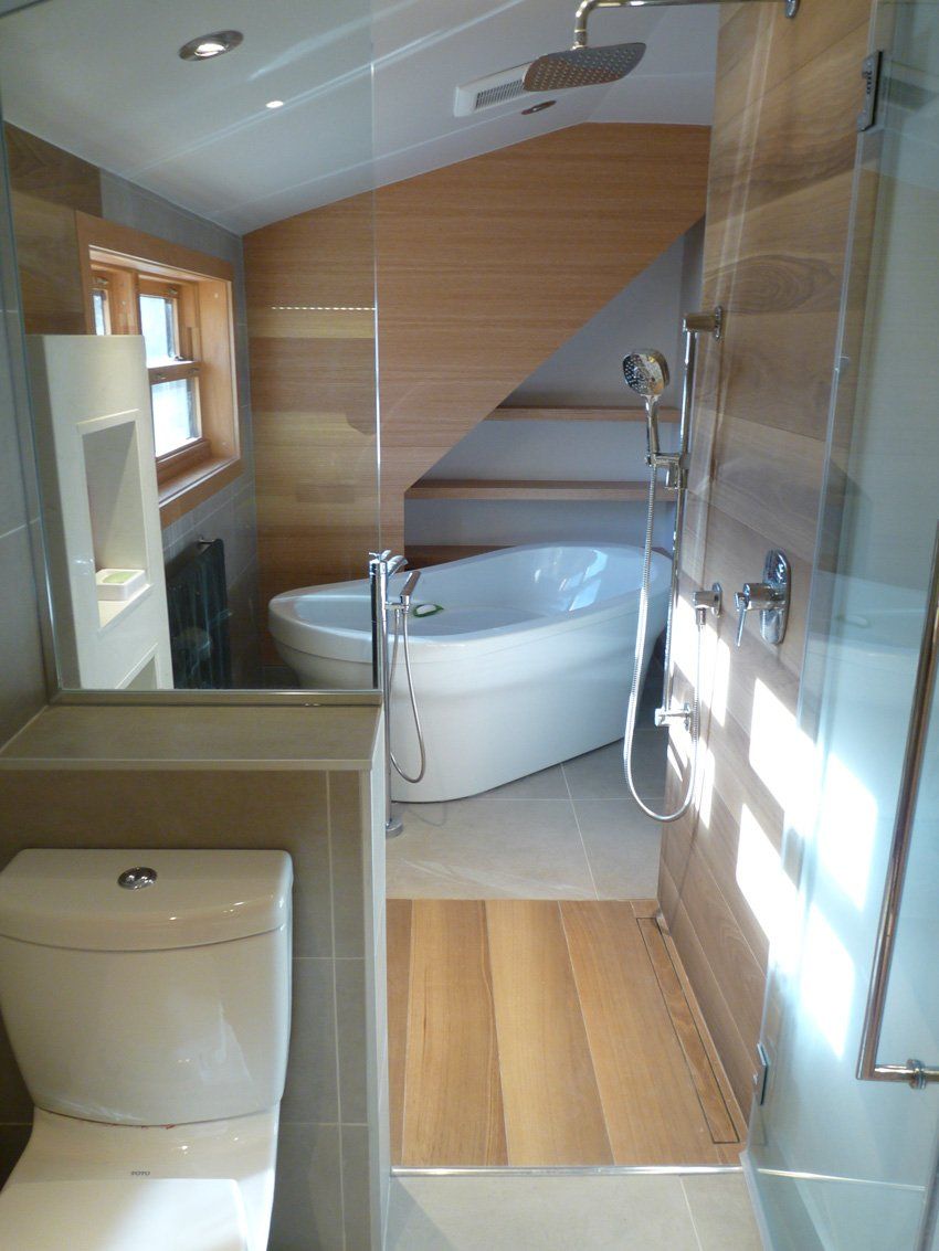 modern bathroom with wood and ceramic flooring