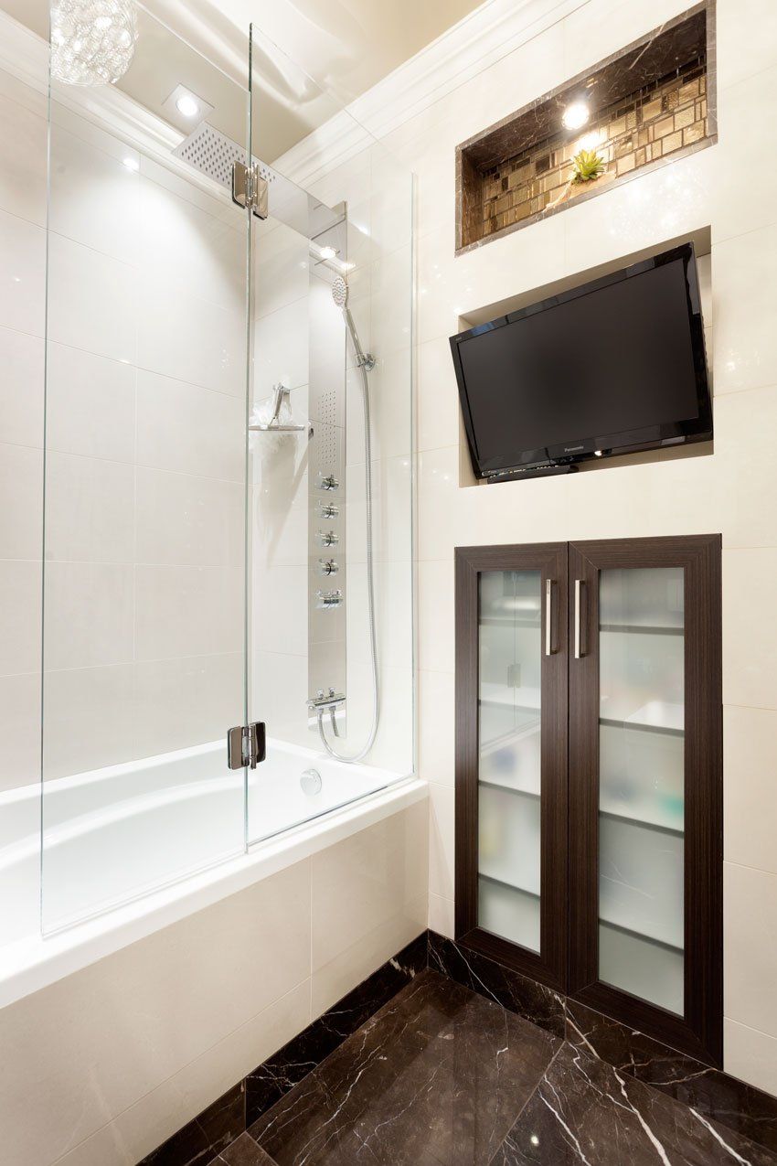 large bathroom with white walls and steel fixtures
