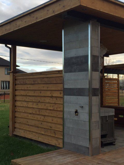 wood and cement patio enclosure