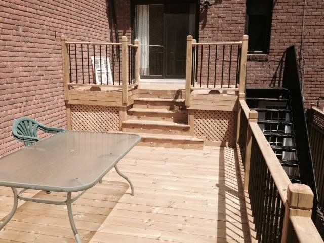 wood patio with metal railings