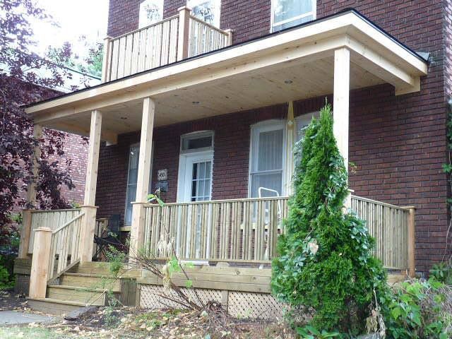 frontyard of home with wooden porch