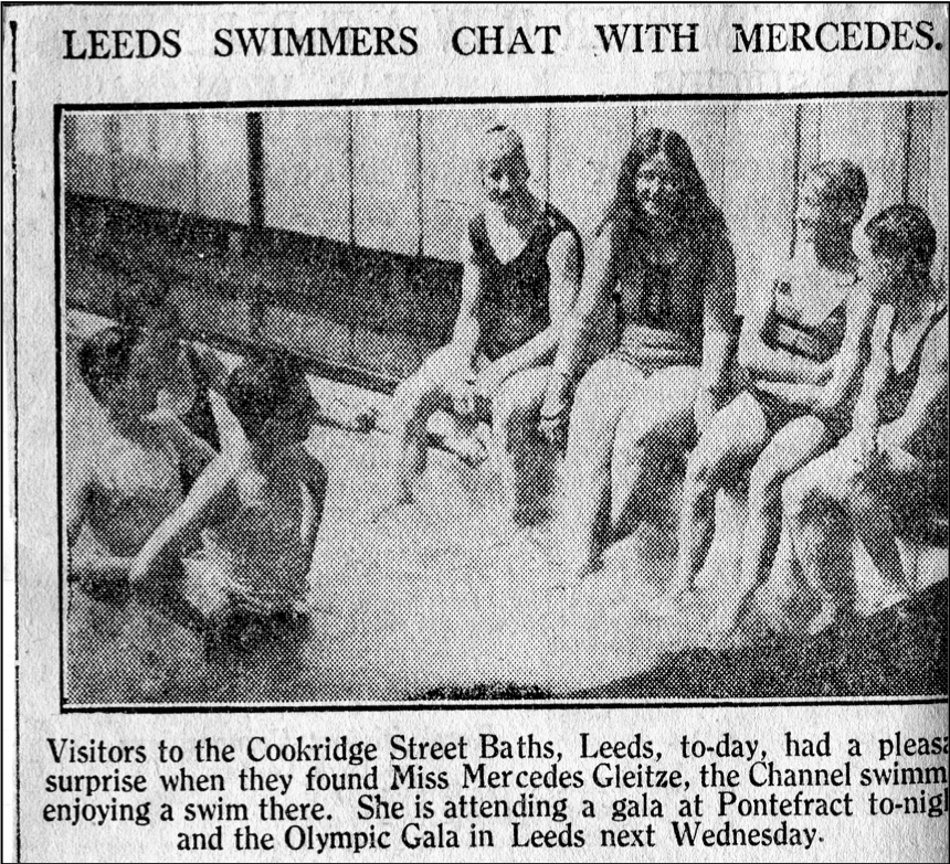 Mercedes on poolside with other swimmers
