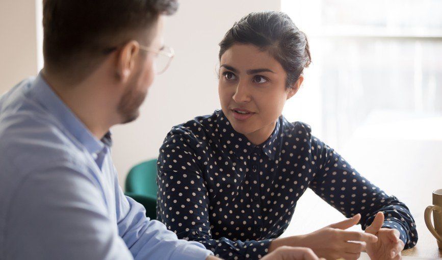 Woman giving legal advice to male client