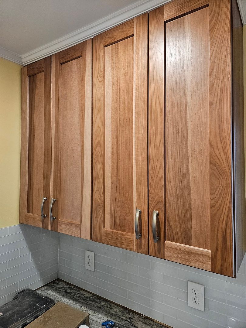 A kitchen with stainless steel appliances and granite counter tops.