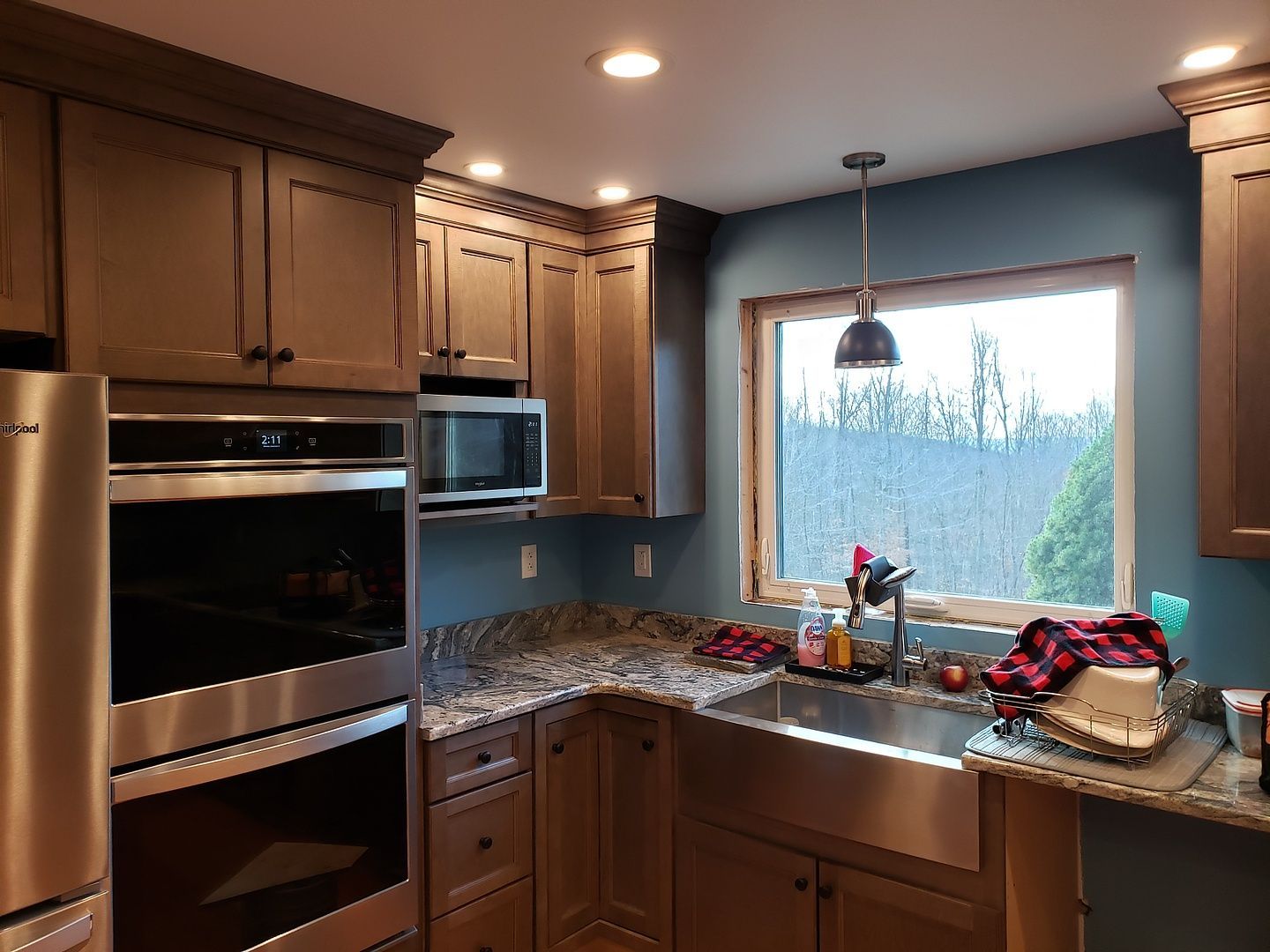 A kitchen with stainless steel appliances and a sink.