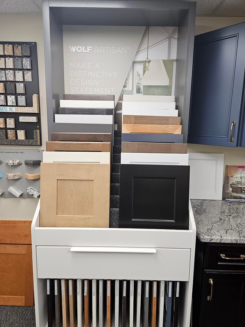 A display case filled with different types of cabinets in a kitchen.