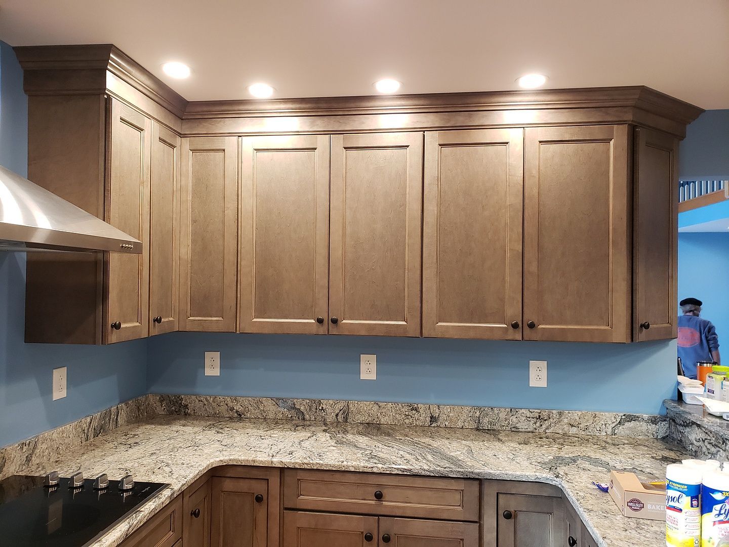 A kitchen with stainless steel appliances and a sink.