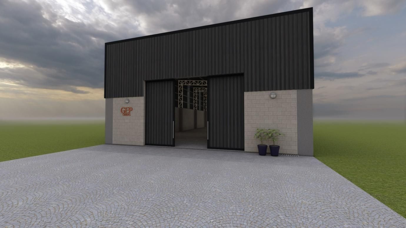 Almacén con puertas abiertas, revestimiento gris, base de hormigón y cielo nublado.