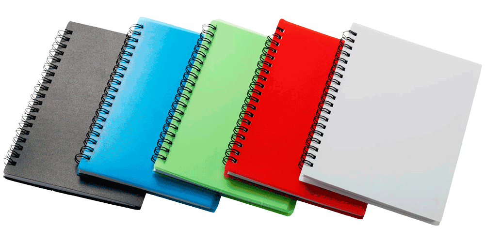 Five spiral notebooks of different colors are stacked on top of each other on a white background.