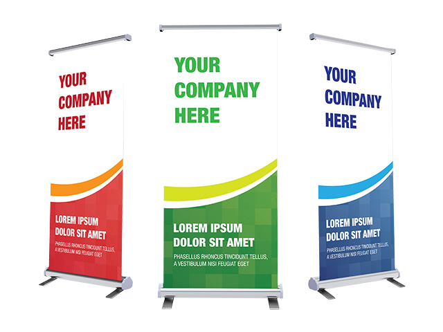 Three roll up banners with the words `` your company here '' on them