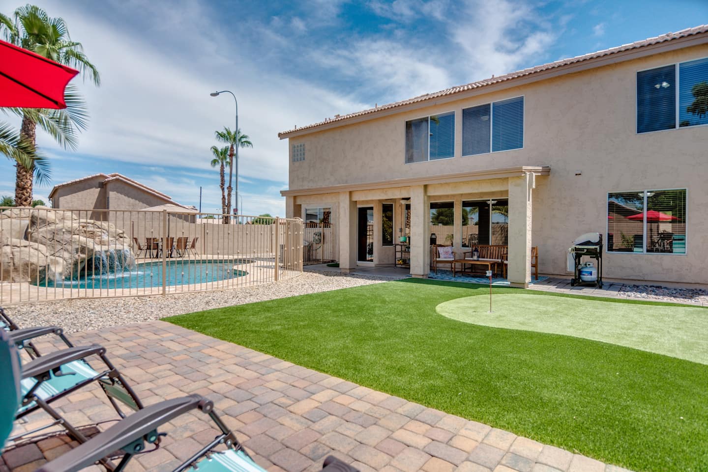 a lush, green synthetic lawn in Sparks NV surrounded by paved walkway