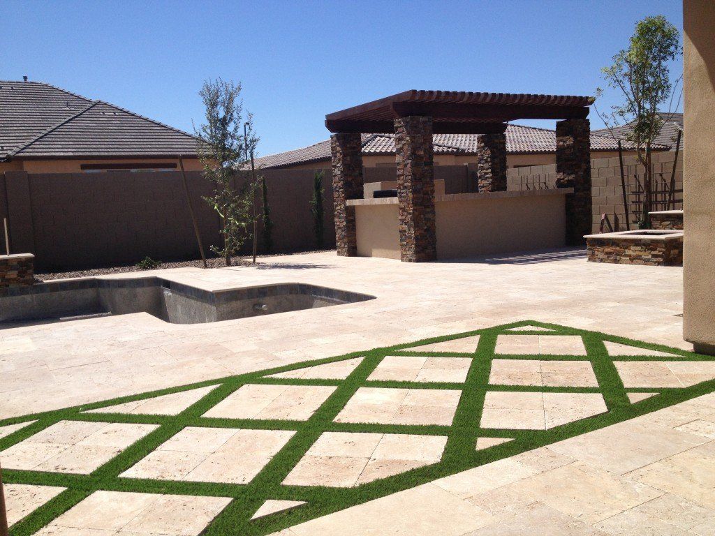 artificial turf between squared pavers in a residential property in Sparks NV