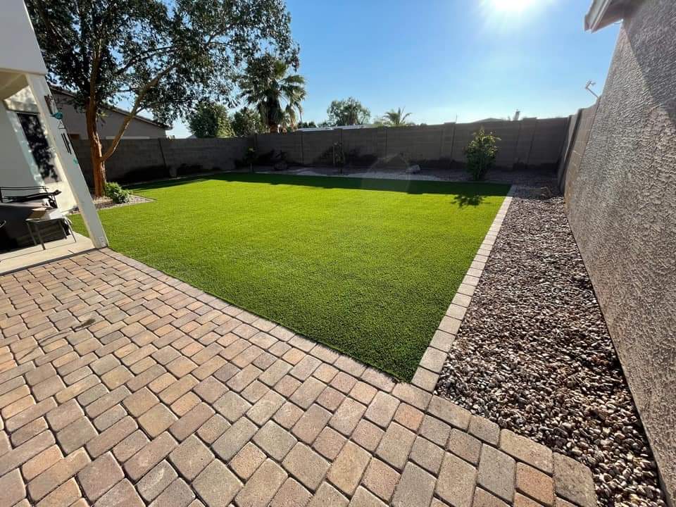 the angled light of the sun accentuates this lush synthetic lawn in Sun Valley NV